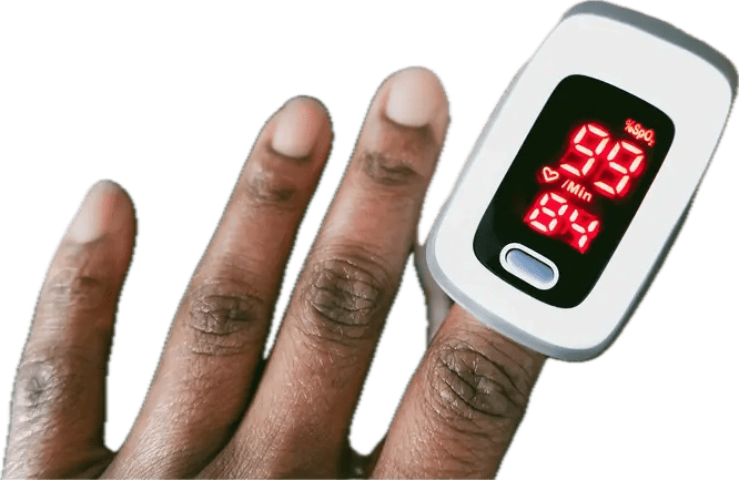 A cropped photo of the left hand of a person with dark brown skin wearing a pulse oximeter on their index finger. The pulse oximeter reads a blood oxygen saturation of 99% and a pulse of 84 beats per minute.